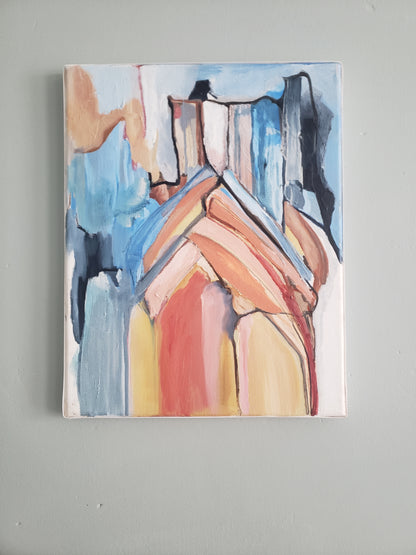 Abstract painting of the Notre Dame Cathedral hanging on a gray wall.