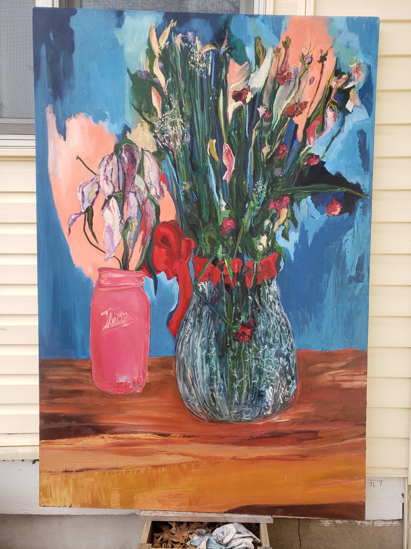 Colorful oil painting of flowers and a vase on a wooden surface